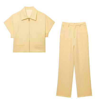 TFMLN 2025 black two-piece set — zip-up top and wide-leg pants.